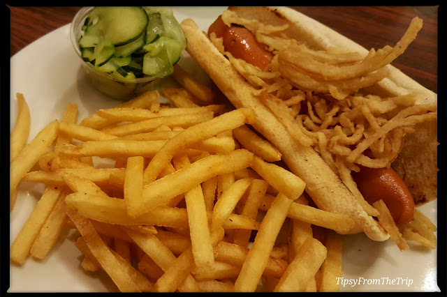 Danish Hot Dog with fried onions, cucumber salad.