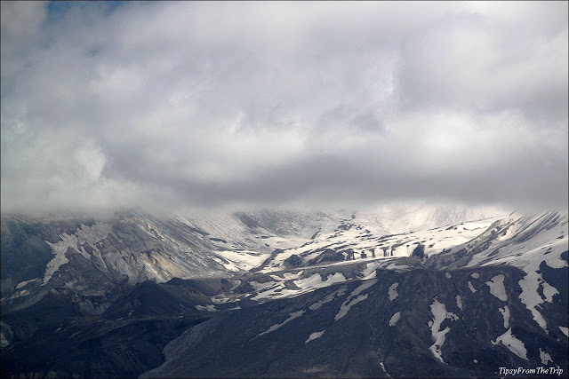 The crater of the volcano and the side of the mountain that collapsed during the eruption