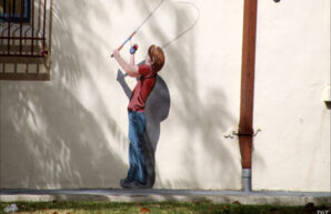 A boy with a fishing rod mural