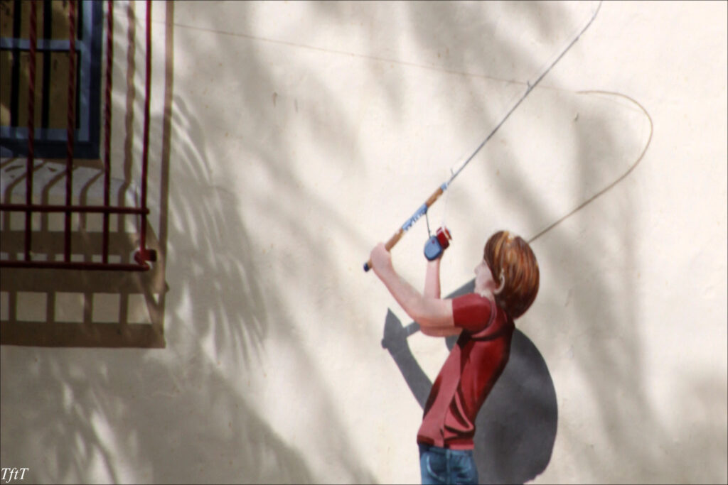 Boy-with-a-fishing-rod -- murals by Greg Brown.